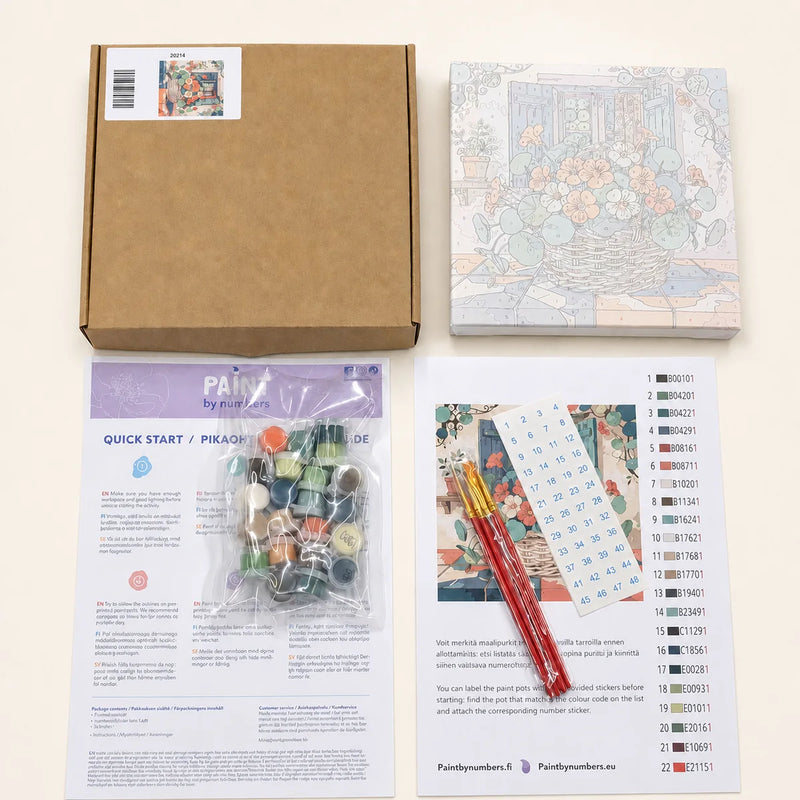 Contents of a framed 20x20 cm paint by numbers kit: paints, brushes, instructions and pre-stretched canvas