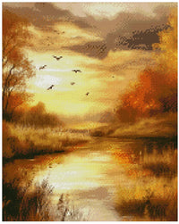 Thumbnail for Diamond painting reference image: An autumn river or wetland at sunset. The water strongly reflects shades of orange and yellow, and black birds fly in the sky.
