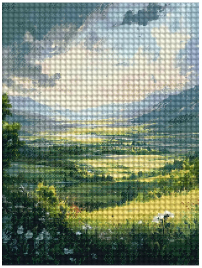 Diamond painting sample image – a bright green valley, distant mountains, and a soft blue-white sky, with a summery peaceful atmosphere.
