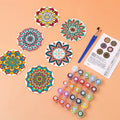 Thumbnail for Pre-painted mandala coasters, paints, brushes, and a color card on the table