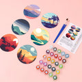 Thumbnail for Landscape-patterned coasters, paints, brushes, and a color card on the table.