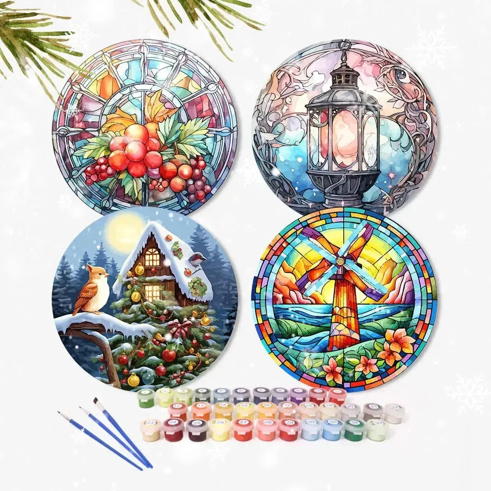 4 numeromaalaus pöytätablettia valkoisellta taustalla. Edessä maalipurkkeja ja siveltimet.