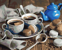 Thumbnail for Kahvikuppeja, macaron-leivoksia ja sininen teepannu puisella pöydällä, numeromaalaus.