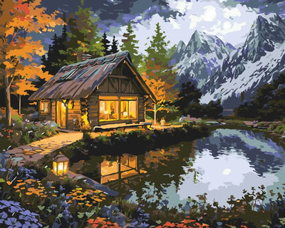 Atmospheric cottage by the lake, surrounded by colorful flowers and mountains in the background, Paint By Numbers.