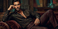 Thumbnail for Diamond painting featuring a dark-haired man lying on a velvet sofa in a luxurious setting.