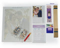 Thumbnail for Custom paint by numbers kit contents: numbered canvas from a wedding photo, colour chart, acrylic paints, brushes, quick guide, and optional extras (premium brush set and wooden frame)