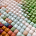 Thumbnail for diamond painting in close-up, the image features different colored square diamonds arranged in a diamond painting.