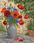 Thumbnail for Paint by numbers of red poppies and blue cornflowers in a grey stoneware jug on a wooden table by a stone wall.