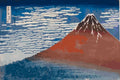 Thumbnail for Paint by numbers of Hokusai's Red Fuji, a rust-red mountain beneath a blue sky of white clouds.