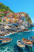 Thumbnail for Diamond painting of a colorful coastal village, where pastel houses rise on the cliffs and boats float on the turquoise sea.