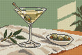 Miniatyrbild: Diamond painting-motiv med ett cocktailglas på en ljus duk med oliver och en olivkvist