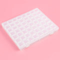 Thumbnail for Transparent plastic storage organizer with 56 small compartments for diamond painting supplies. The box is closed on a pink background.