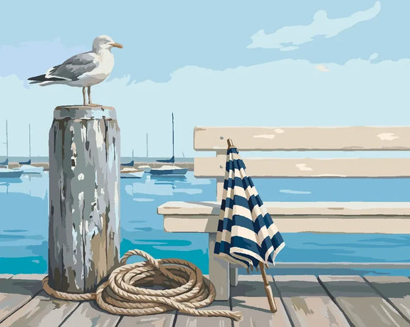 Seagull on a weathered pier with coiled rope and a striped parasol paint by numbers