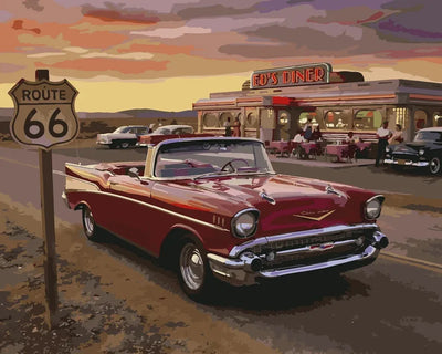 Route 66 numeromaalaus - punainen auto ja diner auringonlaskussa