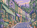 Miniatyrbild: Förhandsvisning: pastellfärgade hus, blomlådor och upplysta butiker vid en kullerstensgata