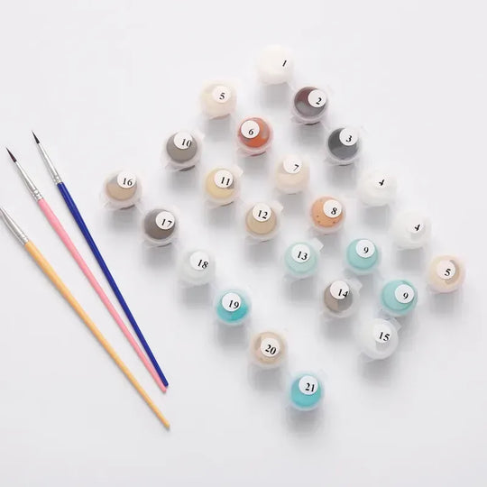 Paint by numbers paint pots and brushes ready to begin