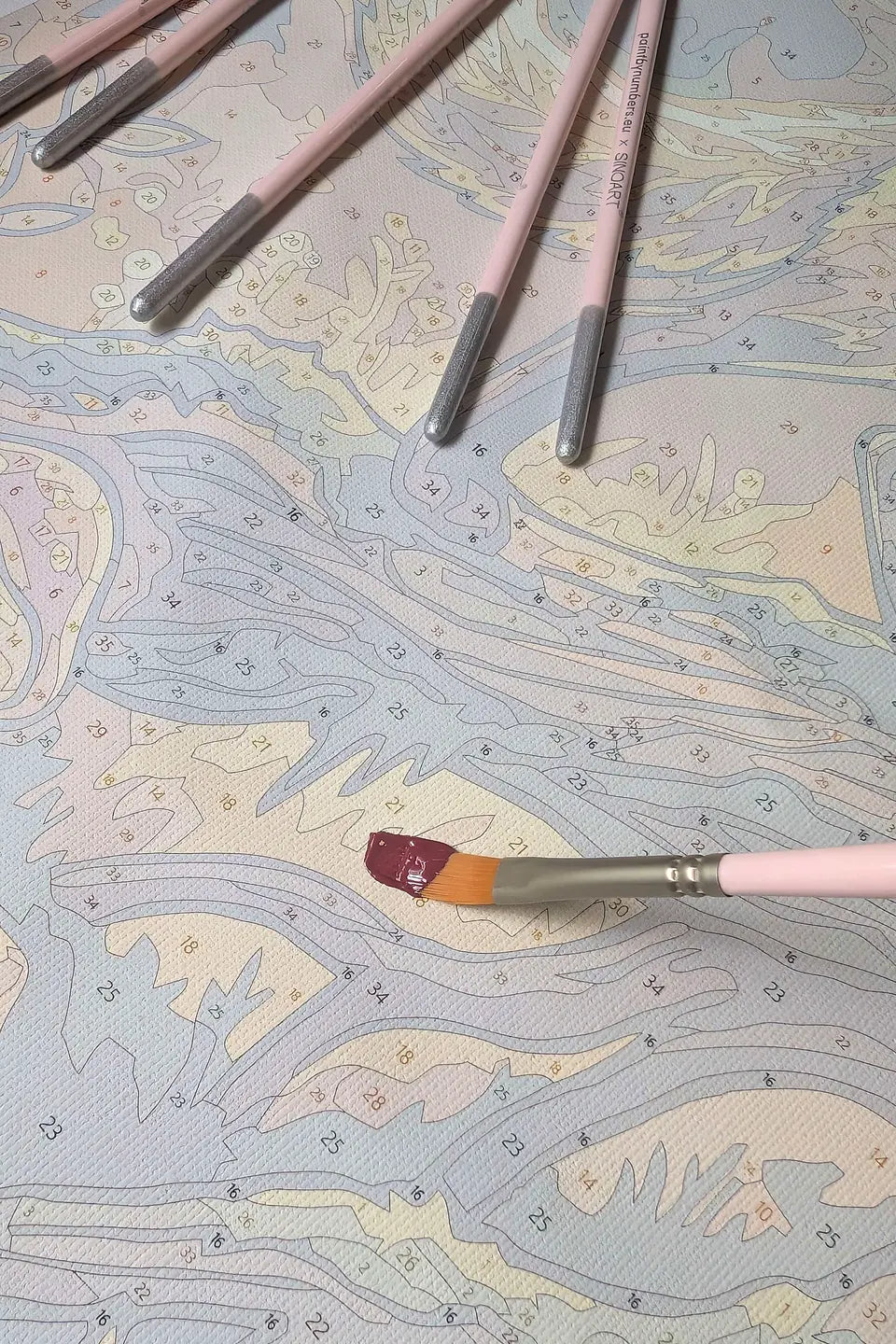 Close-up of a numbered paint by numbers canvas